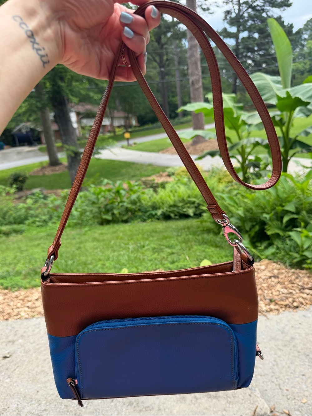 Tignanello Two-Tone Crossbody Bag with a Vibrant Striped Lining